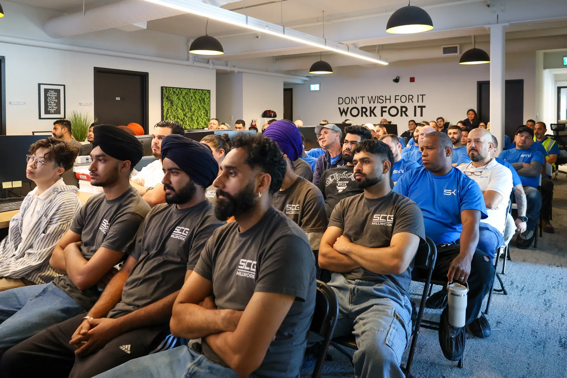Rows of Sky and SCG Millwork crew members seated at the annual safety workshop in the head office
